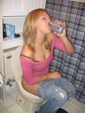 girl drinking while pissing